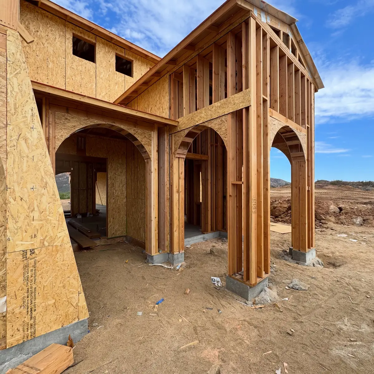 Arched entry framing on a hacienda style custom home