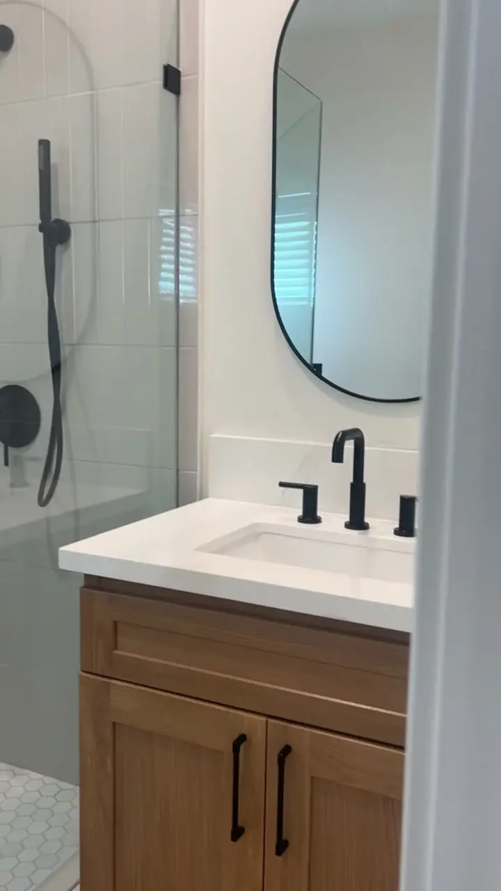 ADU bathroom vanity in white oak with black fixtures