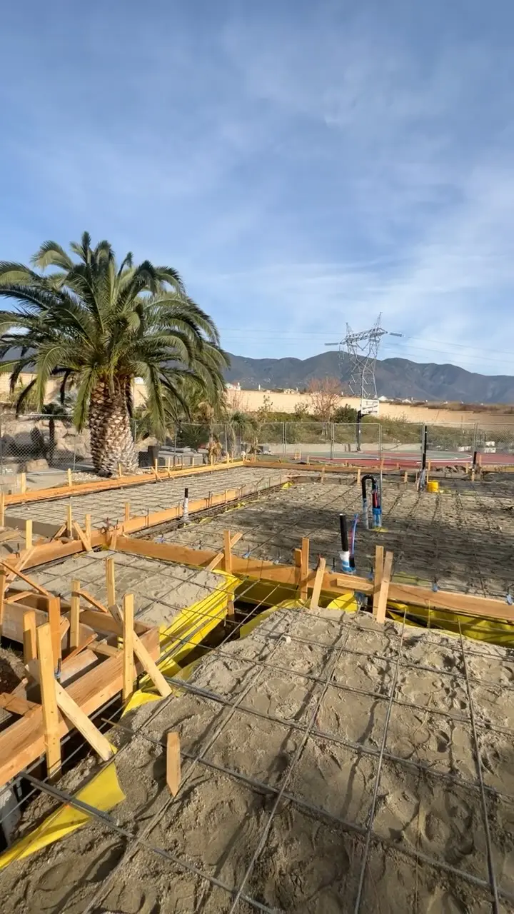 Foundation forms and plumbing stubs ready for concrete