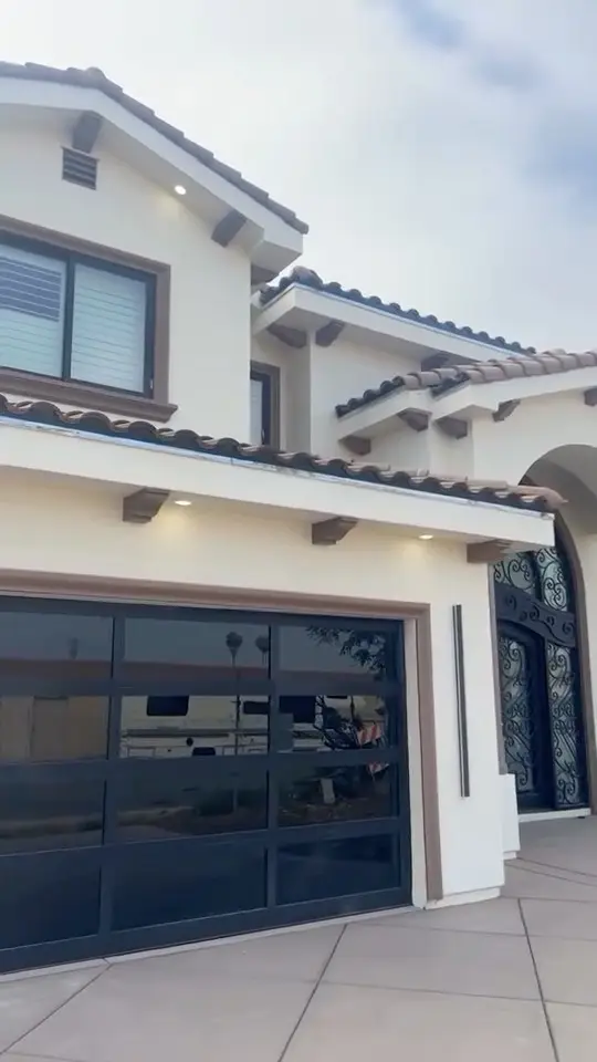Custom home with a glass garage door in Whittier, CA: new custom home front with glass garage door
